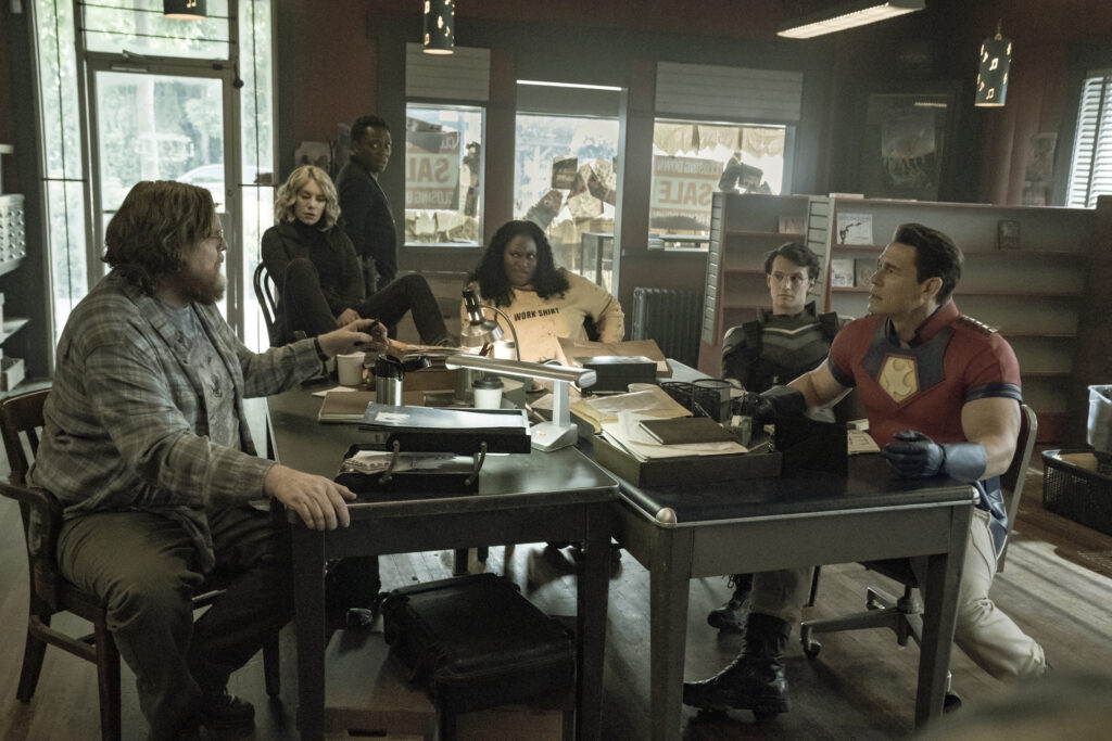 Steve Agee, Jennifer Holland, Chukwudi Iwuji, Danielle Brooks, Freddie Stroma, and John Cena in James Gunn's HBO Max, series, Peacemaker Season 1 Episode 5