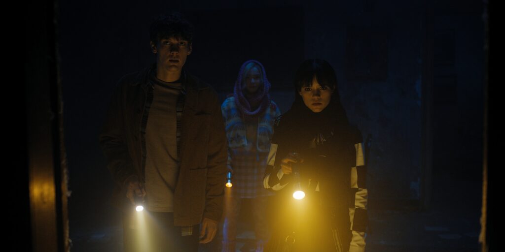 Hunter Doohan, Emma Myers, and Jenna Ortega in Alfred Gough and Miles Millar's Netflix crime comedy supernatural horror series, Wednesday, Season 1 Episode 6