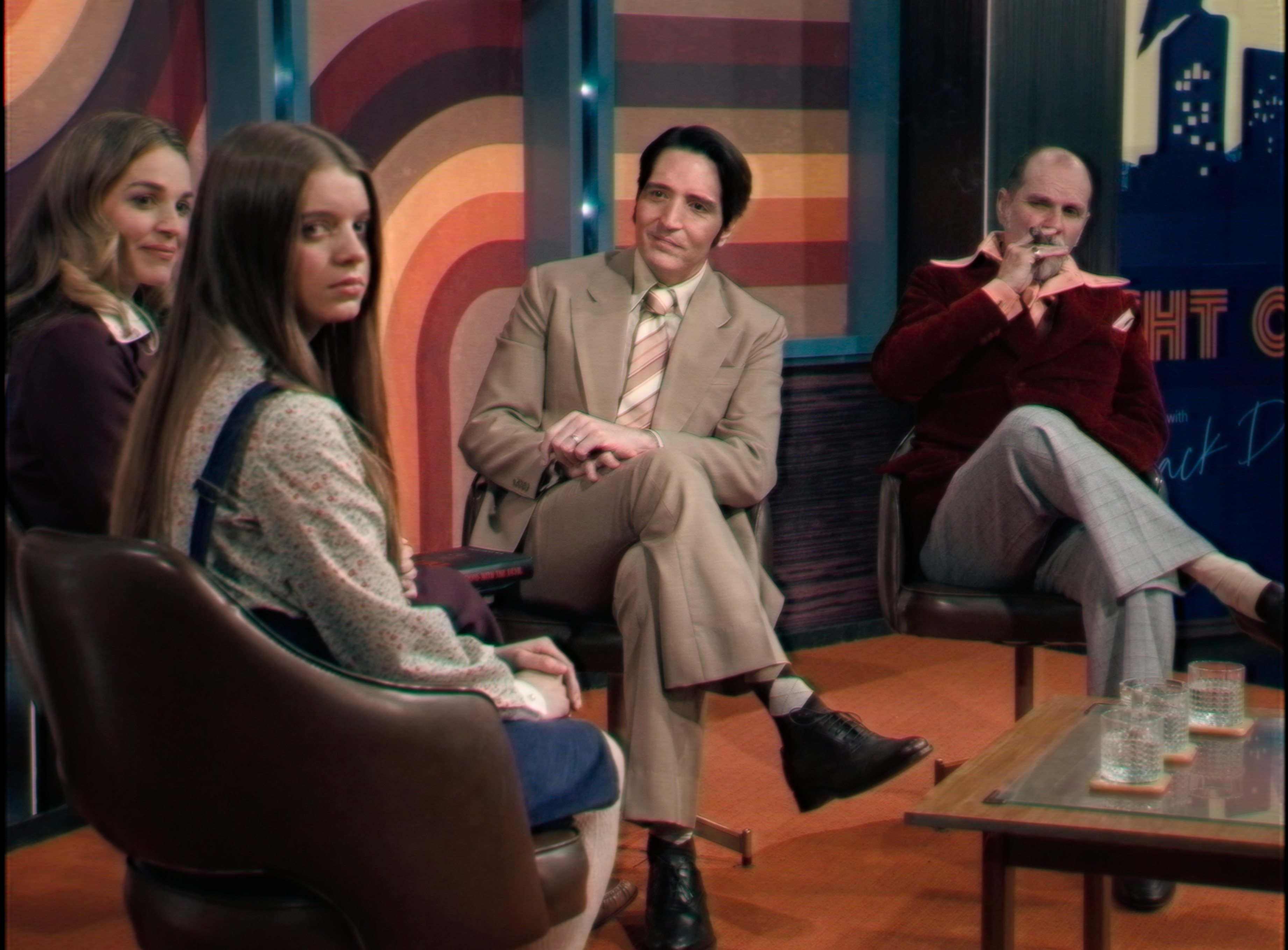 Laura Gordon as June Ross-Mitchell, Ingrid Torelli as Lilly, David Dastmalchian as Jack Delroy, and Ian Bliss as Carmichael Haig in Cameron and Colin Cairnes' supernatural horror film, Late Night with the Devil