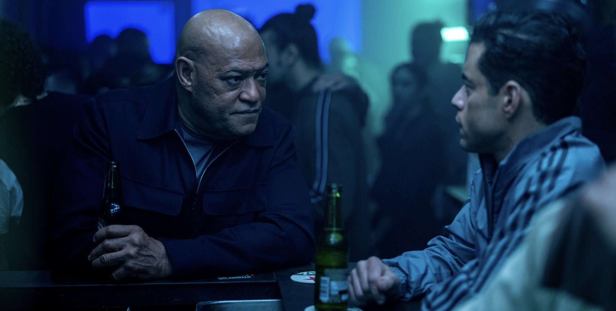 Laurence Fishburne and Rami Malek in James Hawes, Ken Nolan, and Gary Spinelli's spy thriller film adaptation, The Amateur