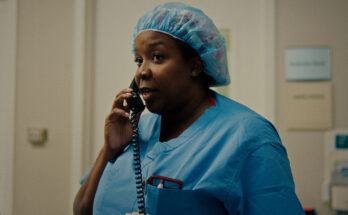 Dr. Favors on the phone. A still from Doc Albany
