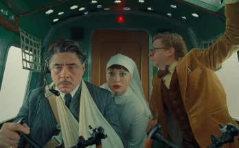 Benicio del Toro, Mia Threapleton, and Michael Cera in Wes Anderson's espionage dark comedy film, The Phoenician Scheme