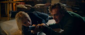 Samara Weaving and Jason Segel in Jorma Taccone, Nick Kocher, and Brian McElhaney's action comedy thriller film, Over Your Dead Body